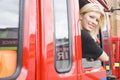 Female firefighter sitting in the cab