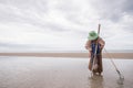 Female fishermen looking for shellfish