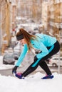 Female fitness sport model outdoor in cold winter weather Royalty Free Stock Photo