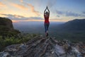 Female fitness stretch to the sky mountain top valley scene Royalty Free Stock Photo