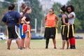 Female Flag Football Players Prepare For Next Play