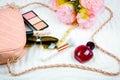 Female flat lay with bag sunglasses and parfume. White background