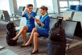 Women stewardesses waiting for the flight at airport