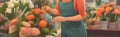 Female florist in apron smiling and standing in a shop, drawing of floral store with woman owner