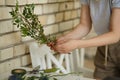 Female florist collect bouqet from fresh flower for wedding ceremony decoration. Event fresh flowers decoration. Florist workflow Royalty Free Stock Photo