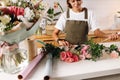 Female florist creating a bouquet