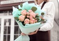 Female florist holding bouquet of beautiful flowers shop Royalty Free Stock Photo