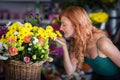 Female florist smelling flower Royalty Free Stock Photo