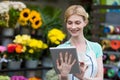 Female florist using digital tablet in florist shop Royalty Free Stock Photo