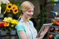 Female florist using digital tablet in florist shop Royalty Free Stock Photo