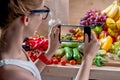 Female food photographer with smartphone Royalty Free Stock Photo