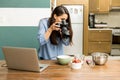 Female food photographer at work