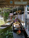 Female food vendor on her boat at floating market