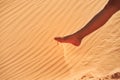 Female foot digs sand Royalty Free Stock Photo