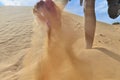 Female foot digs sand Royalty Free Stock Photo