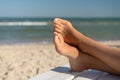 Female foot with hallux valgus close up on the beach Royalty Free Stock Photo