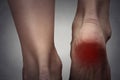 Female foot heel pain colored in red Royalty Free Stock Photo