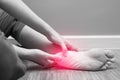 Female foot heel pain with red spot, plantar fasciitis Royalty Free Stock Photo