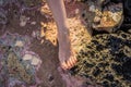 Female foot with painted nails on stones close-up Royalty Free Stock Photo