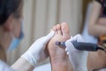 Femaleness i foot in process of pedicure procedure stock photo Royalty Free Stock Photo