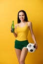 Female football fan holding ball and Royalty Free Stock Photo
