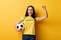 Female football fan holding ball on Royalty Free Stock Photo