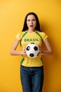 Female football fan holding ball on Royalty Free Stock Photo