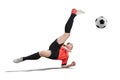 Female football player in orange uniform making Bicycle kick isolated Royalty Free Stock Photo