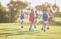 Female football, sports and team playing match on a field while passing, touching and running with a ball. Active, fast Royalty Free Stock Photo