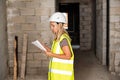 Female foreman officer inspector, building Inspector, engineer or inspector at construction site checking and inspecting Royalty Free Stock Photo
