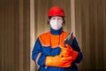 Female foreman with protective gear and face mask Royalty Free Stock Photo