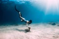 Female freediver underwater. Freediving in transparent sea