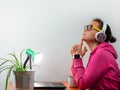 Female freelancer in headphones laptop Work from home, distance e-learning office. Pretty student girl drinking coffee Royalty Free Stock Photo