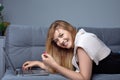 Female freelancer working home. Girl using laptop preparing her project and making notes in copybook. Royalty Free Stock Photo