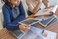 High angle view of businesswomen working on financial statistics documents Royalty Free Stock Photo