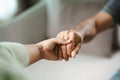 Female friend or family holding hands during cheer up to mental depress man, Psychologist provides mental aid to patient. PTSD Royalty Free Stock Photo