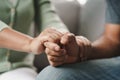 Female friend or family sitting and hold hands during cheer up to mental depress man, Psychologist provides mental aid to patient Royalty Free Stock Photo