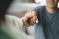 Female friend or family sitting and hold hands during cheer up to mental depress man, Psychologist provides mental aid to patient Royalty Free Stock Photo