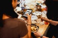 Female Friends dinner party In the house taking picture of new japanese noodles pot at home post on social media. Royalty Free Stock Photo