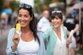 female friends eating ice creams Royalty Free Stock Photo