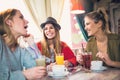 Friends enjoying in conversation and drinking coffee. Royalty Free Stock Photo