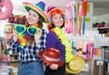 Female friends having fun in festival outfits store Royalty Free Stock Photo