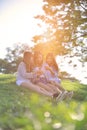 Female Friends Laughing and Looking at Cell Phone Royalty Free Stock Photo