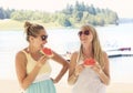 Female Friends laughing together at outdoor picnic