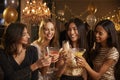 Female Friends Make Toast As They Celebrate At Party