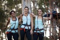 Female friends standing together with arm around in park Royalty Free Stock Photo