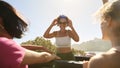 Female Friends Standing Up Through Sun Roof Car And Dancing On Road Trip Through Countryside Royalty Free Stock Photo