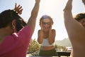 Female Friends Standing Up Through Sun Roof Car And Dancing On Road Trip Through Countryside Royalty Free Stock Photo