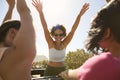 Female Friends Standing Up Through Sun Roof Car And Dancing On Road Trip Through Countryside Royalty Free Stock Photo