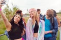 Female Friends Taking Selfie As They Arrive At Entrance To Music Festival Royalty Free Stock Photo